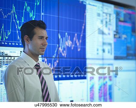Businessman in front of presentation on graphical screens View Large Photo Image Stock Image - Businessman in front of presentation on graphical screens. Fotosearch