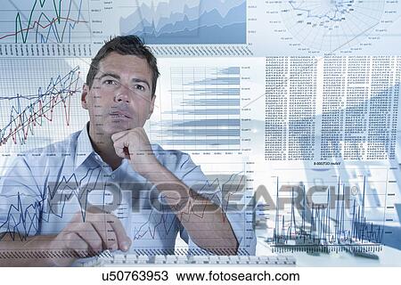 Stock Image - Businessman working with graphs and charts seen through screen. Fotosearch