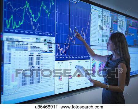 Businesswoman preparing presentation on graphical screens View Large Photo Image Stock Image - Businesswoman preparing presentation on graphical screens. Fotosearch