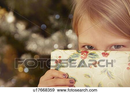 Child with Christmas present View Large Photo Image Stock Photo - Child with Christmas present. Fotosearch