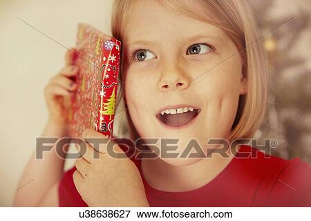 Child with Christmas present View Large Photo Image Stock Photo - Child with Christmas present. Fotosearch