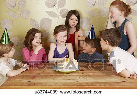 Children at birthday party, girl with cake View Large Photo Image Stock Photo - Children at birthday party, girl with cake. Fotosearch