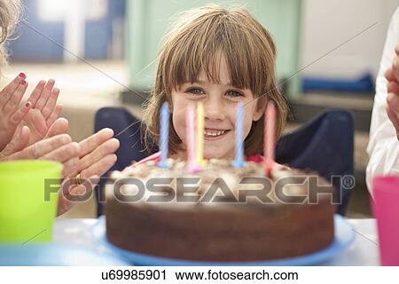 Stock Image - Children enjoying birthday party. Fotosearch