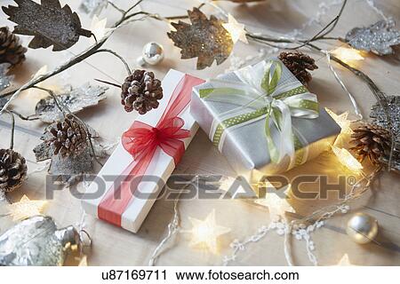 Christmas table with decorative lights and gifts View Large Photo Image Stock Image - Christmas table with decorative lights and gifts. Fotosearch
