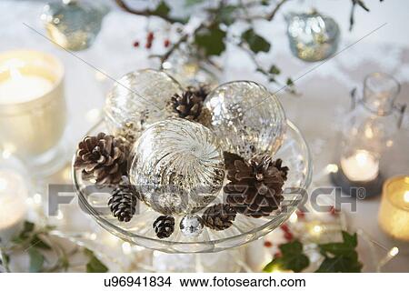 Christmas table with fir cones and glass baubles View Large Photo Image Picture - Christmas table with fir cones and glass baubles. Fotosearch