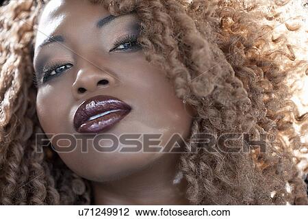Close up of African woman View Large Photo Image Stock Image - Close up of African woman. Fotosearch