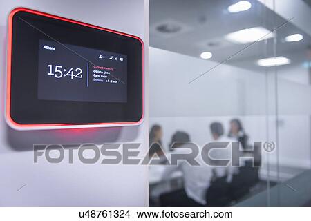 Picture - Close up of meeting room booking system. Fotosearch