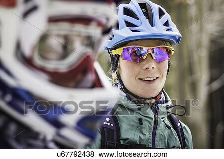 Stock Photo - Close up of two female mountain bikers. Fotosearch