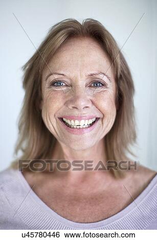Close up portrait of mature woman with wide smile View Large Photo Image Stock Photograph - Close up portrait of mature woman with wide smile. Fotosearch