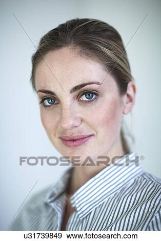 Close up portrait of serene young woman View Large Photo Image Stock Photo - Close up portrait of serene young woman. Fotosearch
