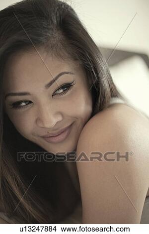 Picture - Close up portrait of smiling attractive young woman. Fotosearch