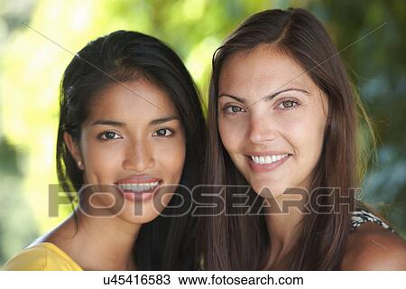 Close up portrait of two woman friends View Large Photo Image Stock Image - Close up portrait of two woman friends. Fotosearch