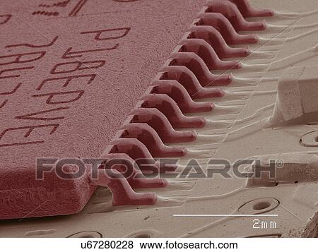 Stock Photo - Coloured SEM of computer chip. Fotosearch