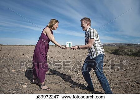 Stock Photo - Couple acting out tradition. Fotosearch