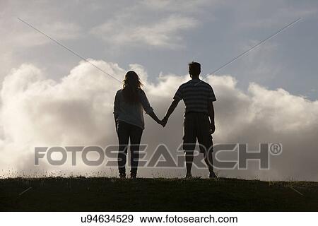 Stock Photo - Couple holding hands. Fotosearch
