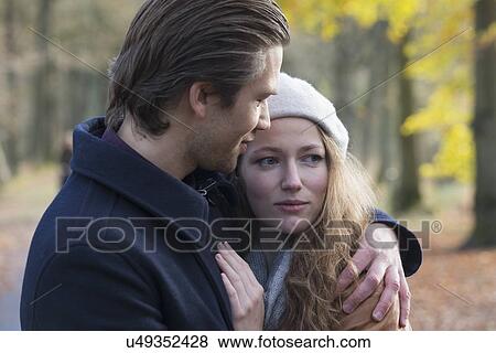 Couple hugging in forest View Large Photo Image Stock Photo - Couple hugging in forest. Fotosearch