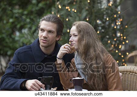 Couple sitting at outdoor cafe View Large Photo Image Picture - Couple sitting at outdoor cafe. Fotosearch
