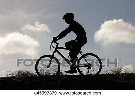 Stock Photo - Cyclist riding on bicycle. Fotosearch