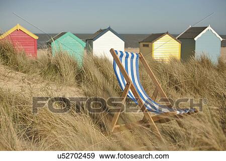 Deck chair and beach huts, Southwold, Suffolk, UK View Large Photo Image Stock Photo - Deck chair and beach huts, Southwold, Suffolk, UK. Fotosearch