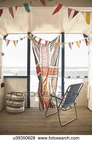 Deck chair and union jack flag in beach hut, Southwold, Suffolk, UK View Large Photo Image Stock Photo - Deck chair and union jack flag in beach hut, Southwold, Suffolk, UK. Fotosearch
