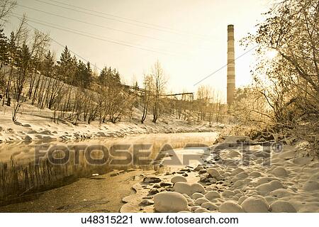 Stock Image - Factory chimney and stream, Russia. Fotosearch