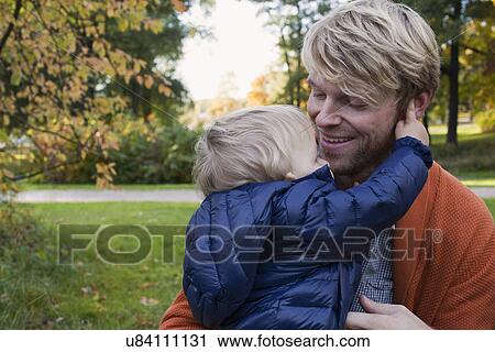 Father and son in park View Large Photo Image Stock Image - Father and son in park. Fotosearch