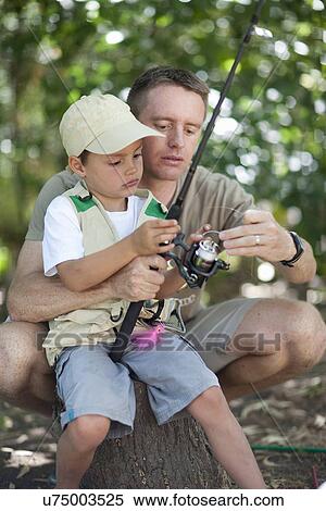 Father and son on fishing trip View Large Photo Image Stock Photography - Father and son on fishing trip. Fotosearch