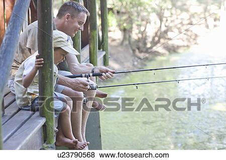 Father and sons fishing by stream View Large Photo Image Stock Photo - Father and sons fishing by stream. Fotosearch