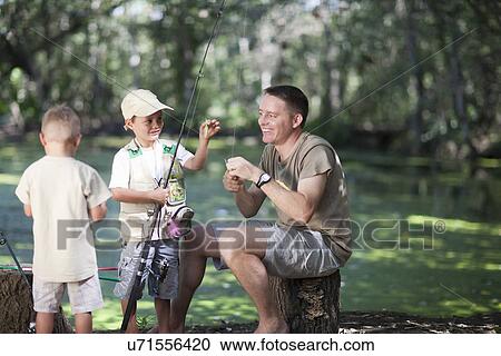 Father and sons on fishing trip View Large Photo Image Stock Image - Father and sons on fishing trip. Fotosearch