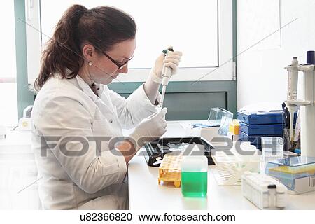 Female scientist working with samples View Large Photo Image Stock Image - Female scientist working with samples. Fotosearch