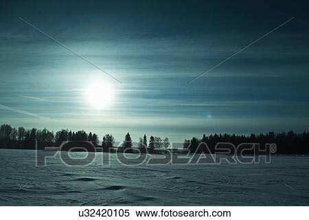 Stock Photography - Field with snow in winter sunlight. Fotosearch