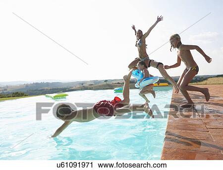 Five people jumping into swimming pool View Large Photo Image Stock Image - Five people jumping into swimming pool. Fotosearch