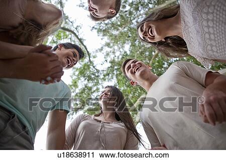 Friends forming circle View Large Photo Image Stock Image - Friends forming circle. Fotosearch