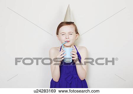 Stock Photo - Girl drinking from plastic cup with straw. Fotosearch