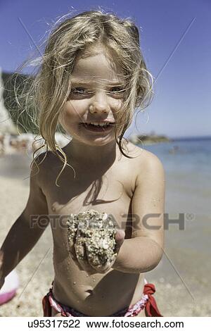 Girl playing on beach View Large Photo Image Stock Image - Girl playing on beach. Fotosearch