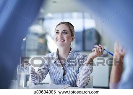 Group of businessmen and women enjoying a meeting View Large Photo Image Stock Photography - Group of businessmen and women enjoying a meeting. Fotosearch