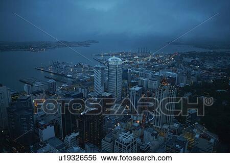 Stock Photograph - High angle view of Auckland at night, New Zealand. Fotosearch
