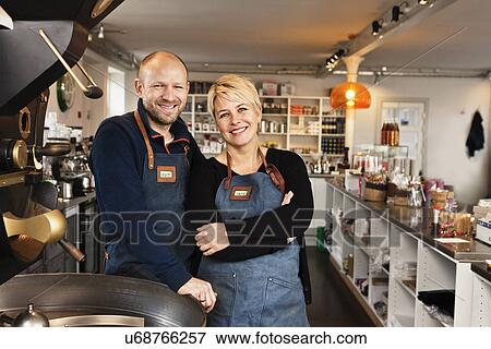 Mature couple in coffee shop kitchen View Large Photo Image Stock Photo - Mature couple in coffee shop kitchen. Fotosearch