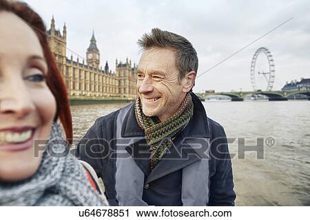 Stock Image - Mature couple sightseeing, London, UK. Fotosearch