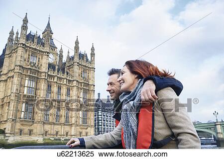Mature couple sightseeing on Thames boat, London, UK View Large Photo Image Stock Photography - Mature couple sightseeing on Thames boat, London, UK. Fotosearch