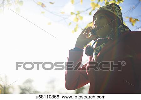 Mature woman talking on cellphone in autumn park View Large Photo Image Stock Photography - Mature woman talking on cellphone in autumn park. Fotosearch
