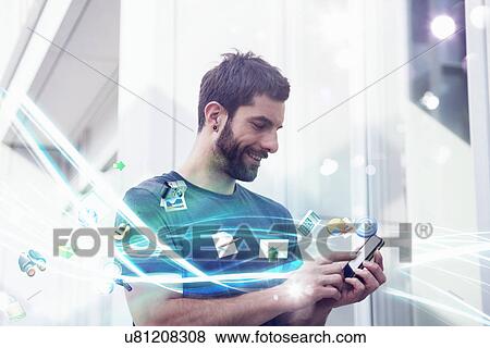 Mid adult man with apps and lights coming from smartphone View Large Photo Image Stock Photo - Mid adult man with apps and lights coming from smartphone. Fotosearch