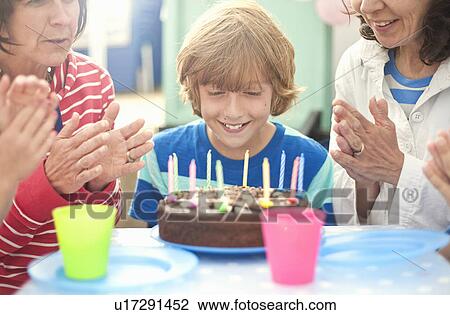 Mother and children enjoying birthday celebration View Large Photo Image Stock Image - Mother and children enjoying birthday celebration. Fotosearch