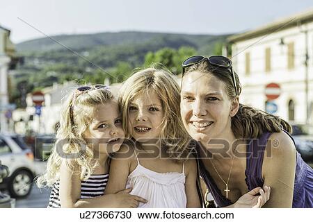 Stock Image - Mother and daughters on vacation. Fotosearch