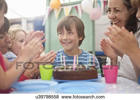 Mother and group of children enjoying birthday party View Large Photo Image Stock Photo - Mother and group of children enjoying birthday party. Fotosearch