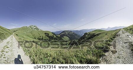 Panoramic view of two dirt tracks and mountain landscape, Achensee, Tyrol, Austria View Large Photo Image Picture - Panoramic view of two dirt tracks and mountain landscape, Achensee, Tyrol, Austria. Fotosearch