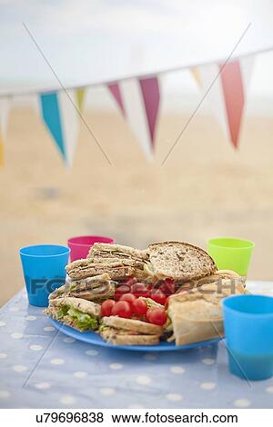 Picnic table and bunting, Southwold, Suffolk, UK View Large Photo Image Stock Photo - Picnic table and bunting, Southwold, Suffolk, UK. Fotosearch