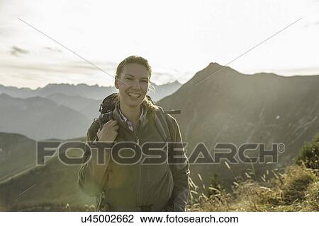 Portrait of a mid adult woman backpacker, Achensee, Tyrol, Austria View Large Photo Image Stock Image - Portrait of a mid adult woman backpacker, Achensee, Tyrol, Austria. Fotosearch