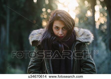 Portrait of attractive young woman in forest View Large Photo Image Picture - Portrait of attractive young woman in forest. Fotosearch