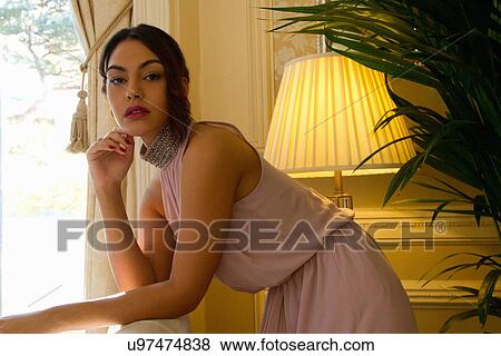Stock Photo - Portrait of attractive young woman in luxury hotel. Fotosearch
